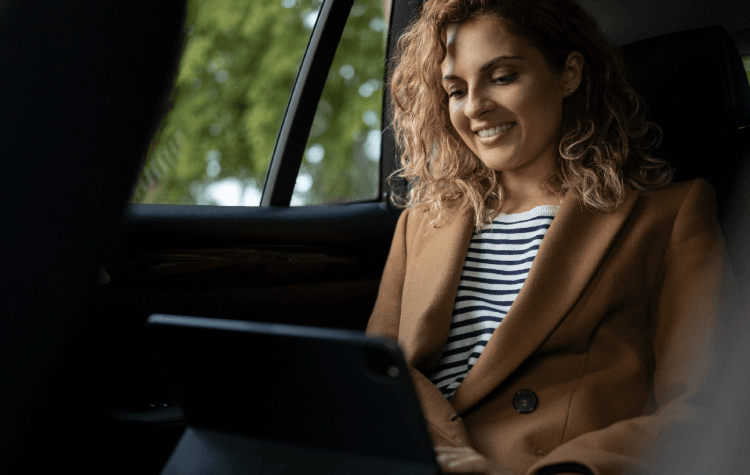 A passenger traveling in a car while working 