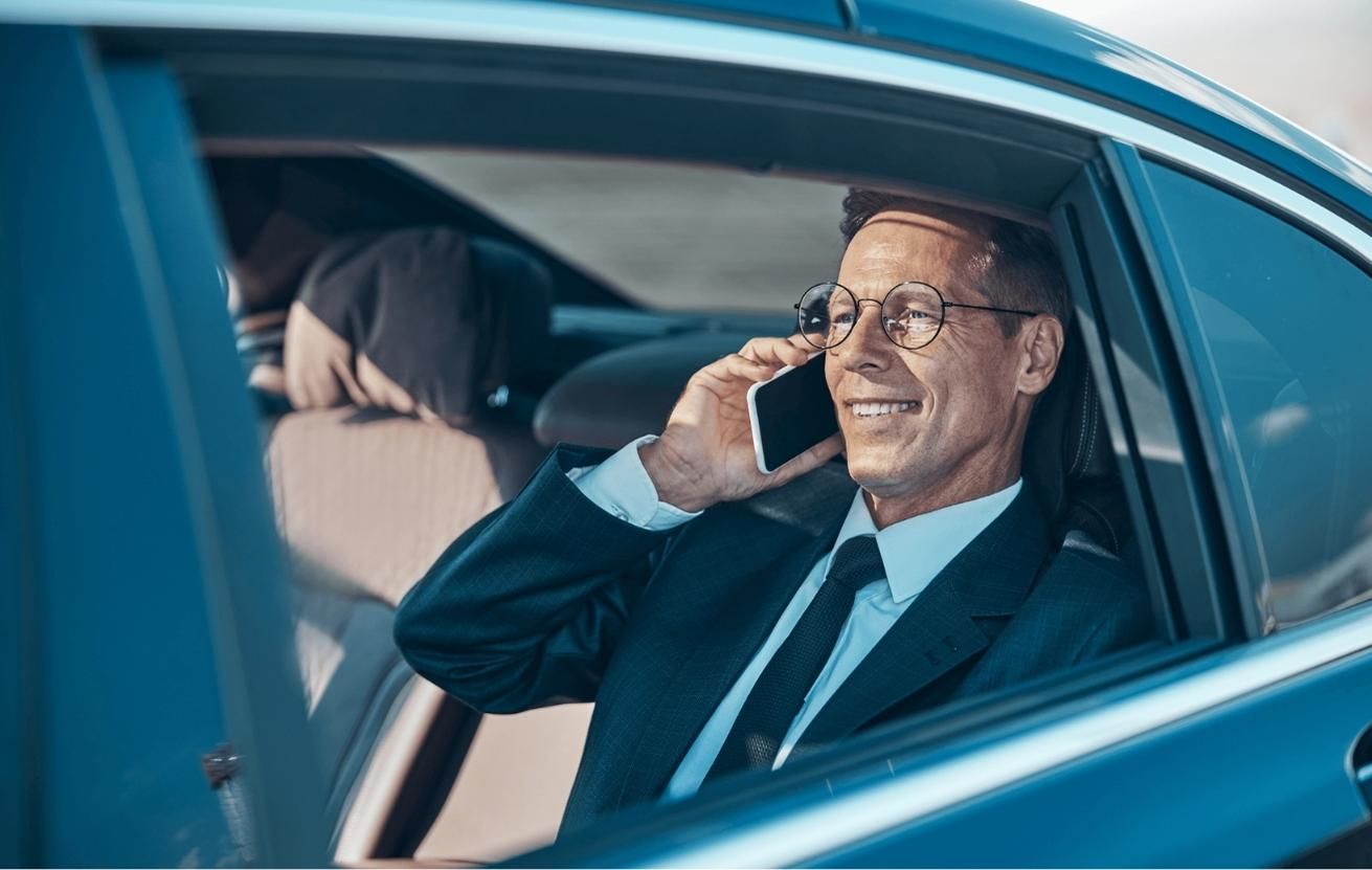 Man talking on the phone in his private car service