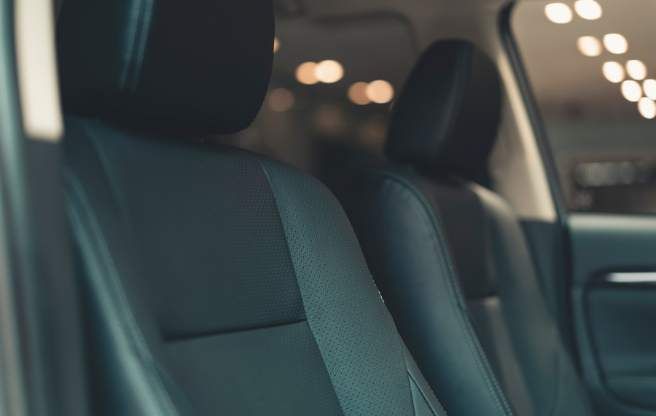 The backseat of a black car transfer