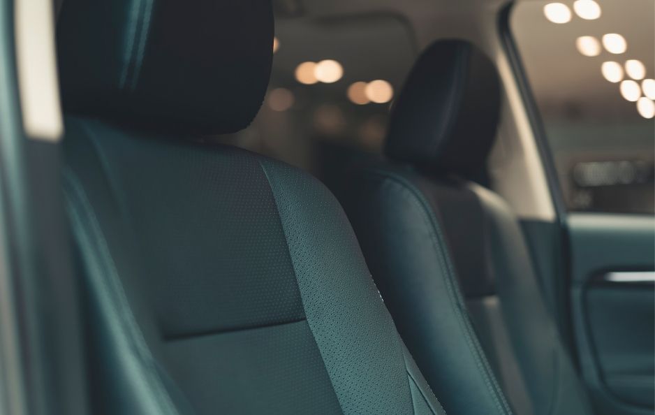 The backseat of a black car transfer