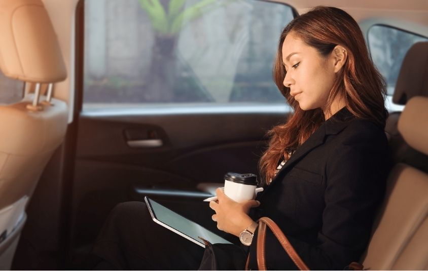 Women working in the back of her professional car service